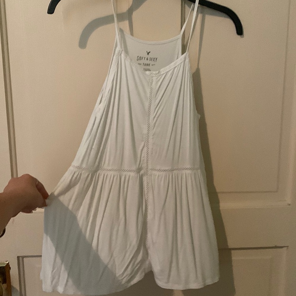 XS white tank american eagle soft & sexy. has see through detailing cross shape.
